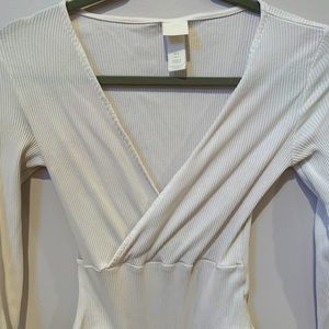 White long-sleeve, low cut body suit